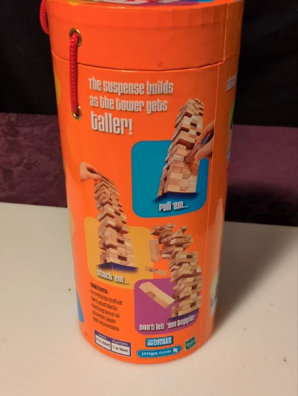 Hasbro Jenga Wooden Block Game - Orange Multicolor Tube- Tan Wooden Blocks